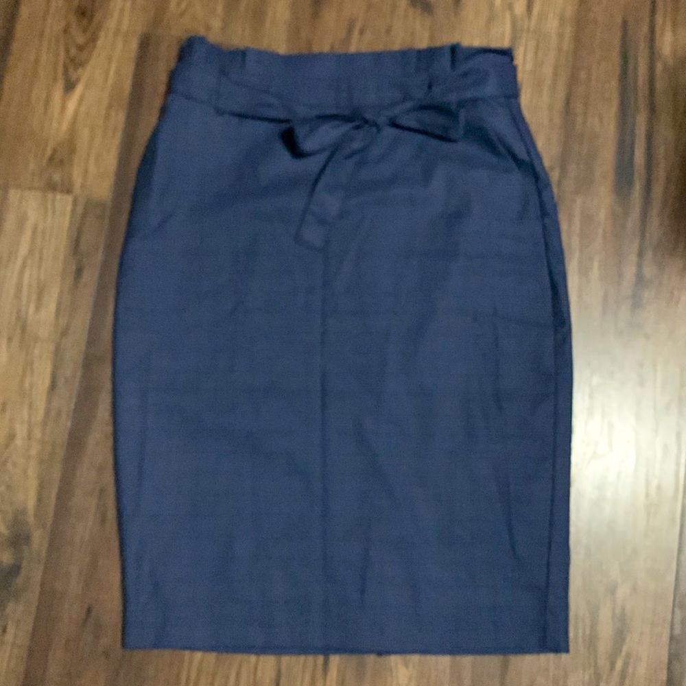 Blue tweed plaid pencil skirt with paper bag detail and tie.